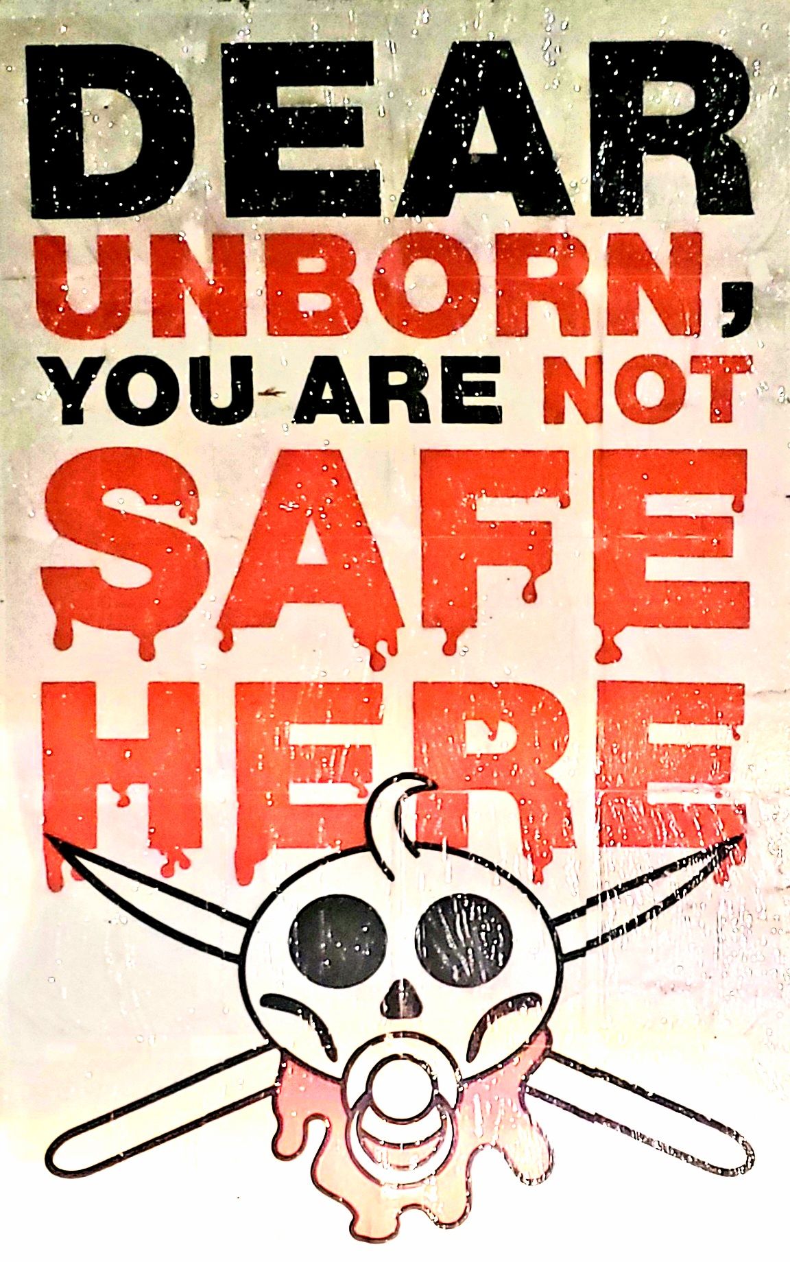 Pro-life, anti-abortion poster with a found in Yakima, WA saying "Unborn not safe here"