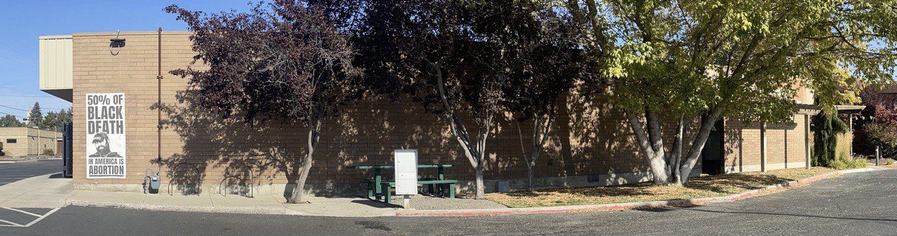 Panoramic view of Yakima's Planned Parenthood with a pro-life poster of Kanye West.