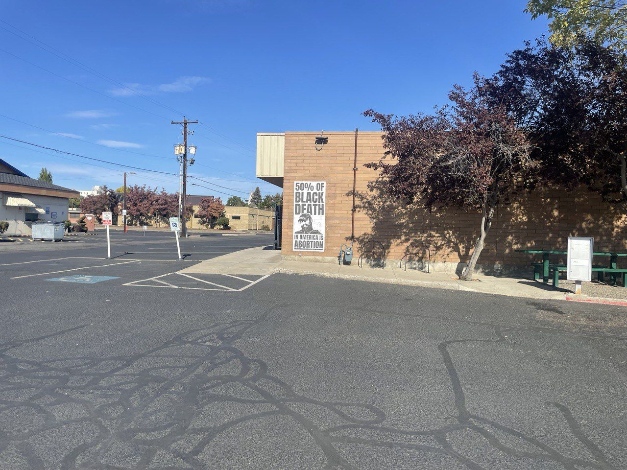 Black and white poster of Kanye West pro-life quote on the side of Yakima's Planned Parenthood.