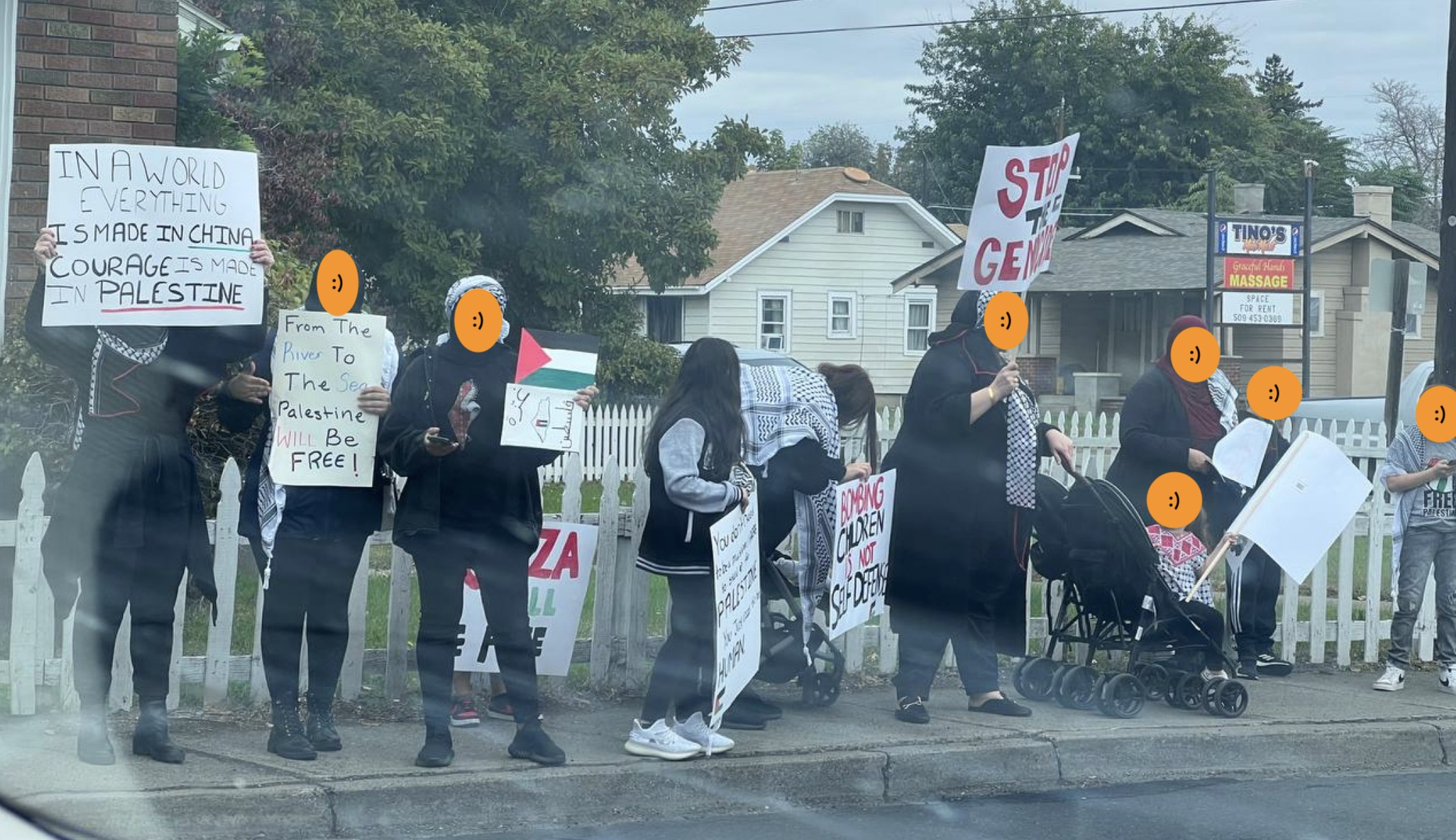 Pro-Palestinian protestors demonstrating with signs.