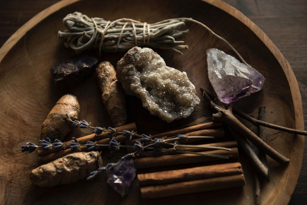 A witch's bowl of spices, herbs, and crystals.