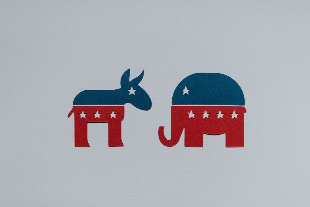 Cartoon of the Democrat donkey and the Republican elephant logos.