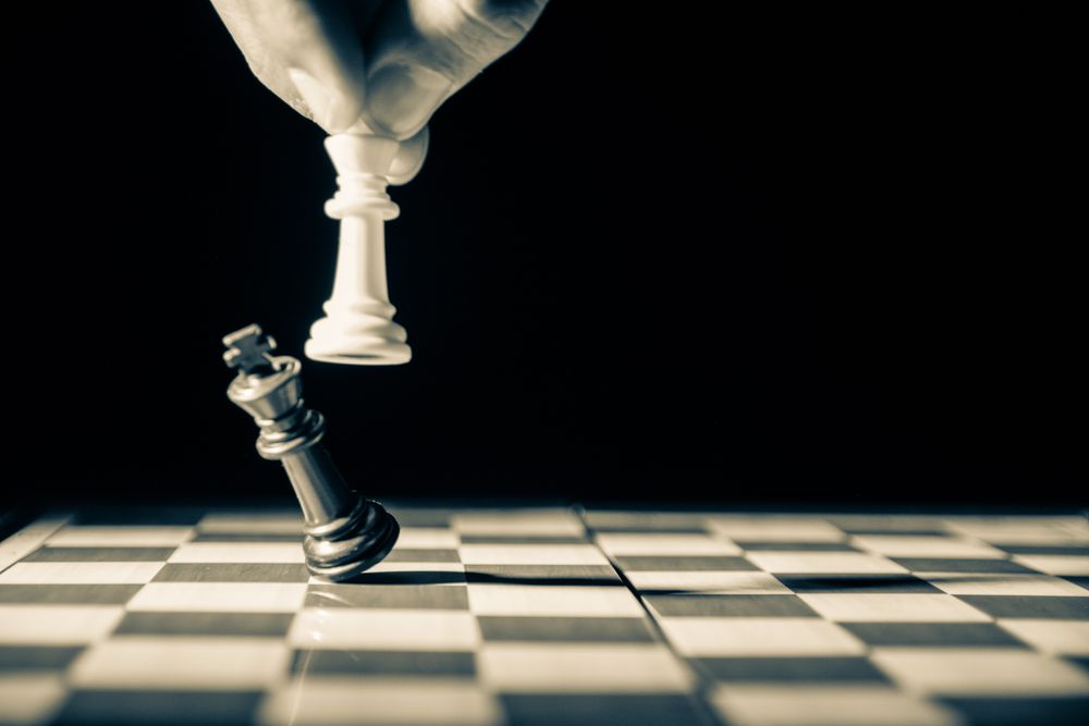 A queen knocks over the king in chess.