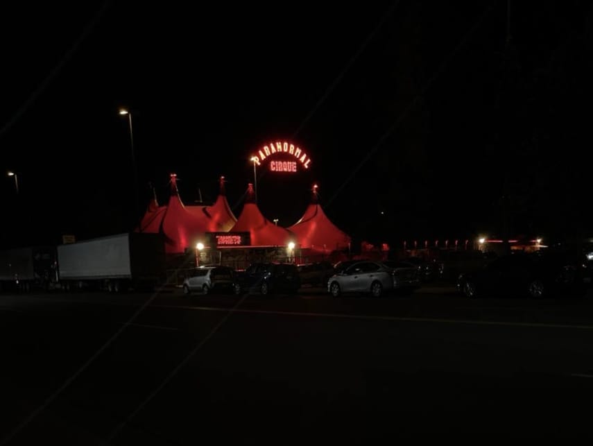 A red circus tent labeled "Paranormal Cirque" in Yakima, WA.